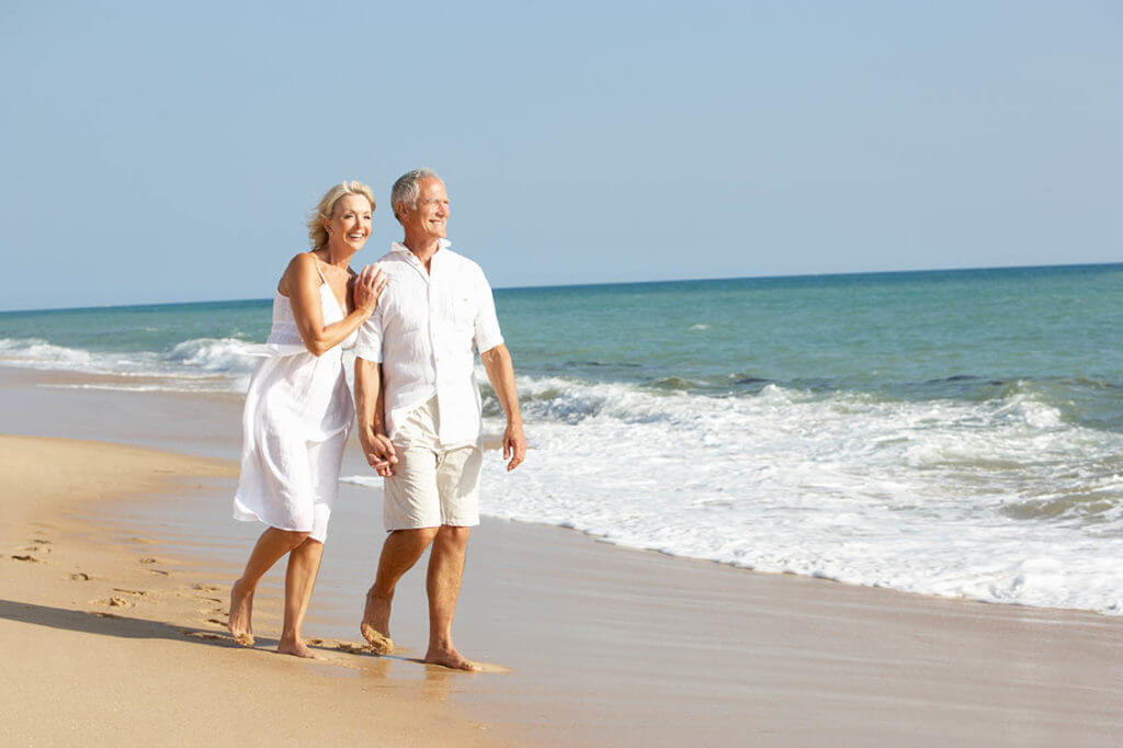 bigstock-Senior-Couple-Enjoying-Beach-H-13918301-2-1024x682